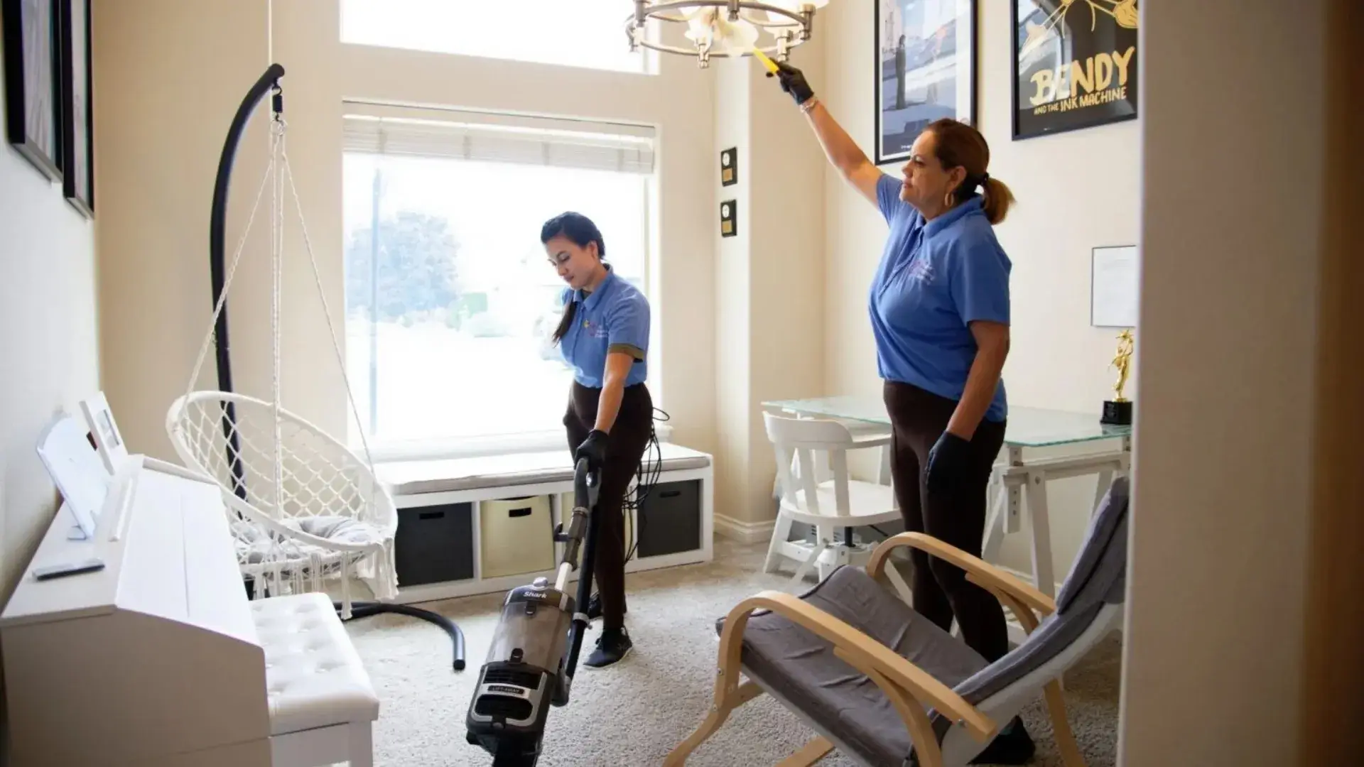 Cleaning team providing deep cleaning services in Tri-Cities with vacuuming and detailed dusting